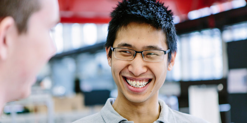 Male student smiling in thermofluids mezzanine