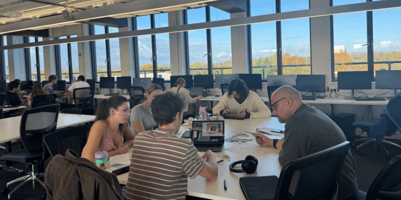 Students learning with their laptops on their MArch architecture degree