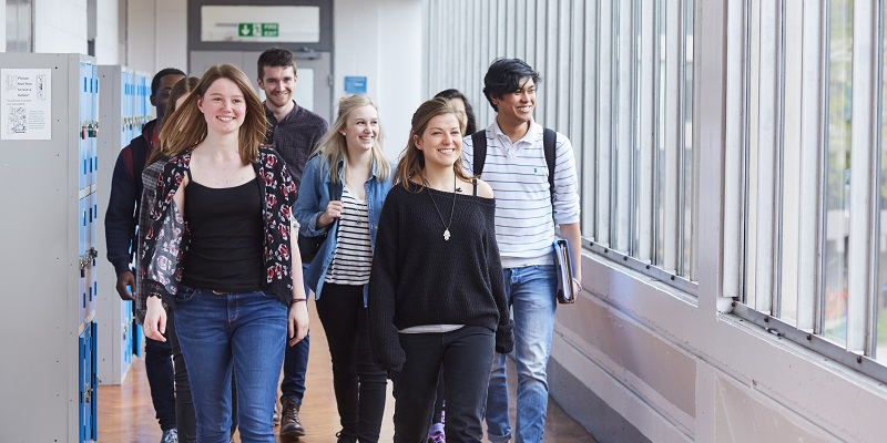 Students walking through the School of Physics and Astronomy at the University of Leeds