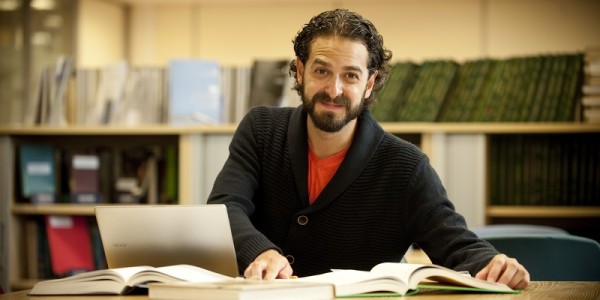 Postgraduate student reading a book