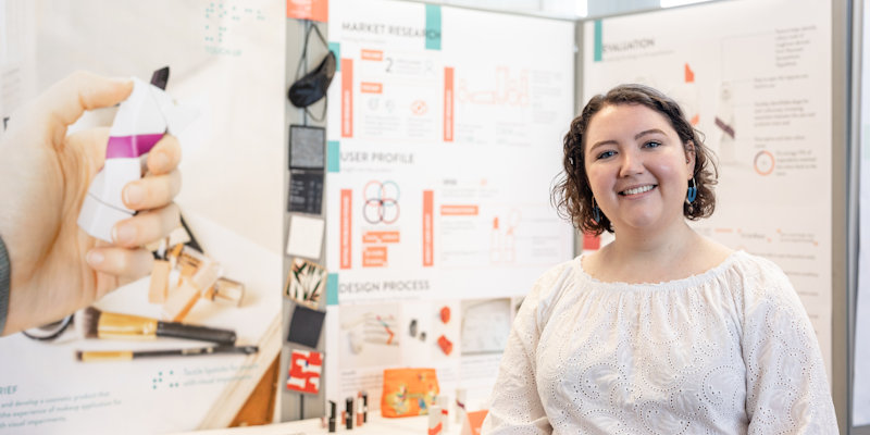 Female product design student with project at product design showcase