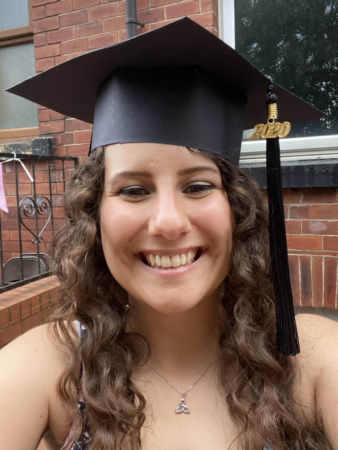 Holly Dimmick wearing her graduation hat