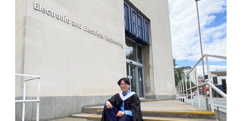 profile picture of student jihai zhong in front of the electronic and electrical engineering building