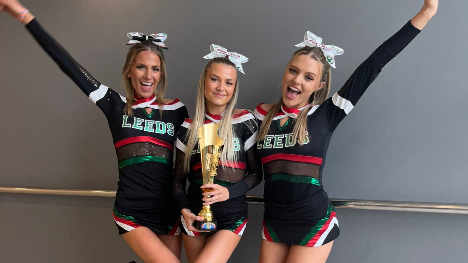Students in cheerleading society with an award