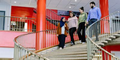 Students walking down the stairs in the School of Civil Engineering