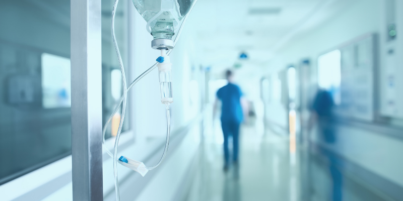 Silhouette of a doctor walking in a hurry in the hospital corridor.