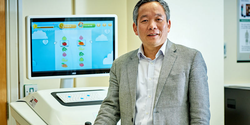 Professor Shane Xie with rehabilitation equipment