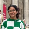 Close up headshot of Larissa wearing a green and white jumper