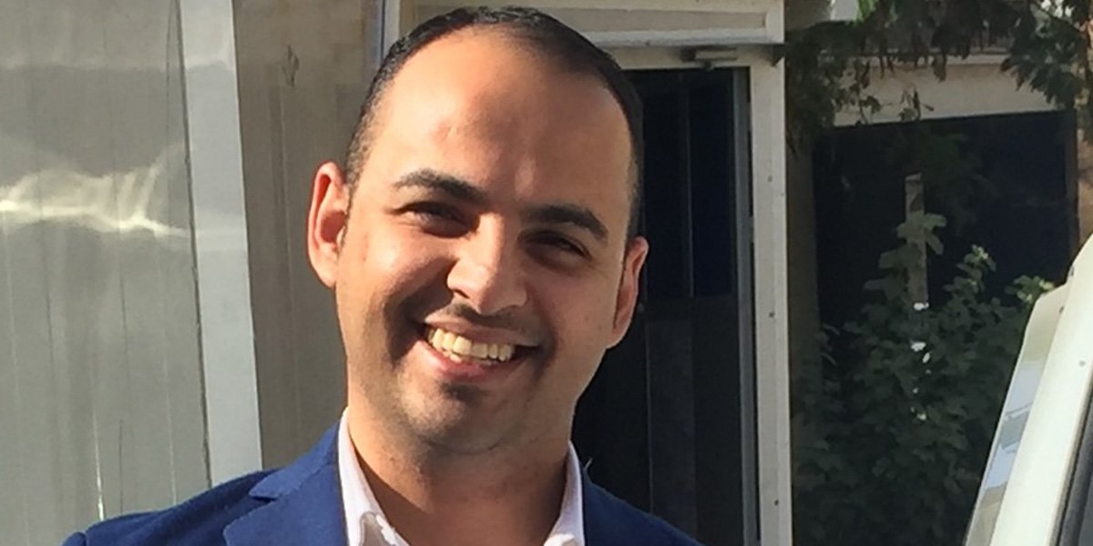 A headshot of a smiling Ahmed Gailani.