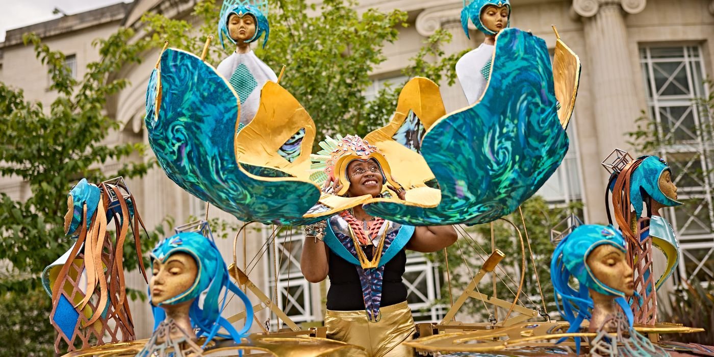 Khadijah Ibrahiim wearing the carnival costume outside of the Chemistry Building