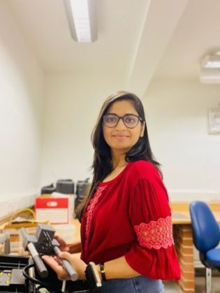 Civil Engineering PhD student Harshita Garg working in a lab