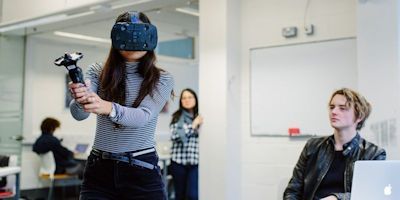 Computing student using VR headset