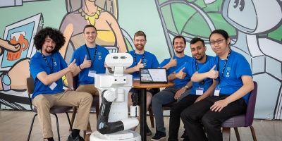 The Leeds Autonomous Service Robots team with their robot.