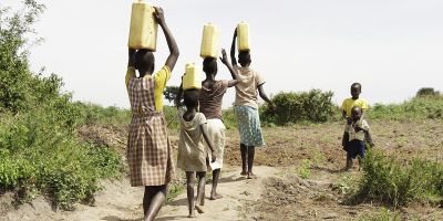 African women carrying water