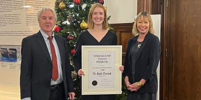 Sarah Crossland holding a certificate for her IMechE tribology bronze medal for 2023