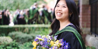 Image of Louisa Kamajaya graduating from the University of Leeds outside the Great Hall after studying Chemistry.