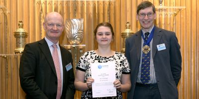 Holly Foster receiving a certificate