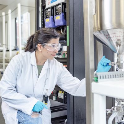 Image of a female student in a post graduate chemical engineering nuclear lab
