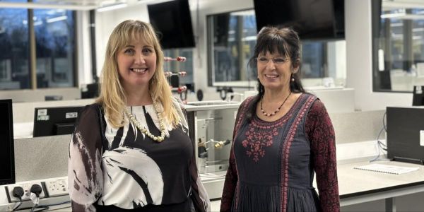 Professor Alison Voice and Professor Samantha Pugh standing in a classroom.