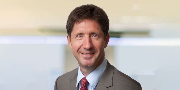 A headshot of Professor Steve Scott, smiling at the camera