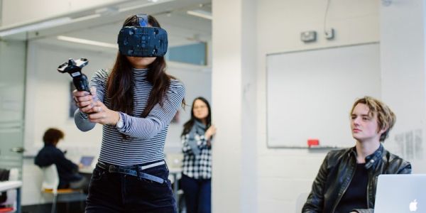 Gaming undergraduate using VR headset