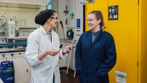 Chemistry students talking in the lab