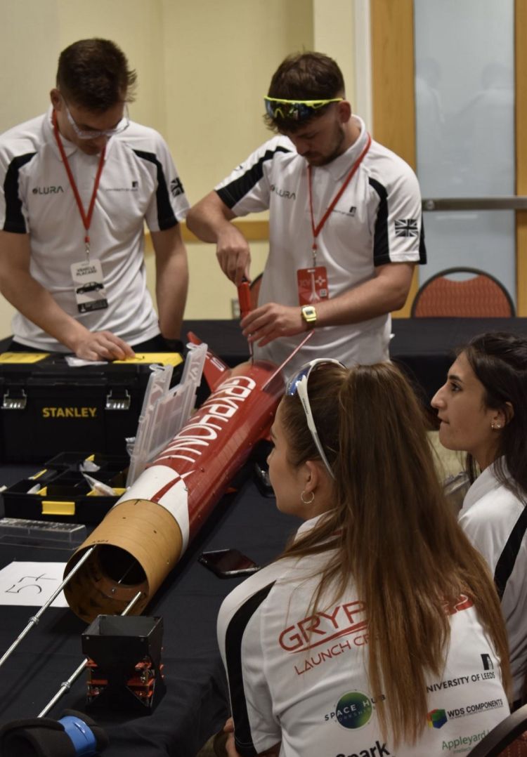 A photograph of the Leeds Rocketry Association team working on their rocket.