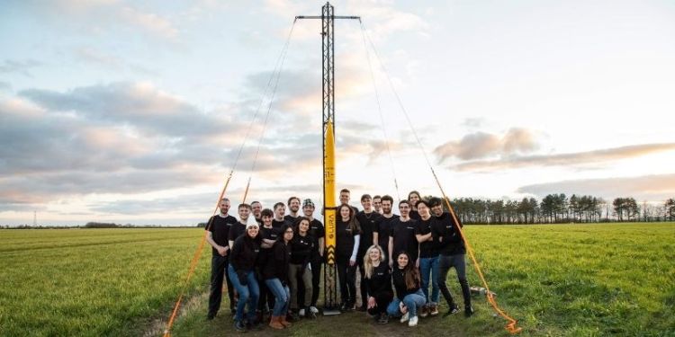 A group shot of Leeds University Rocket Association (LURA), with their rocket in the middle.