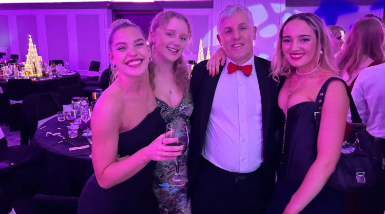 Audrey-rose skinner at the chemistry ball with two friends and an academic