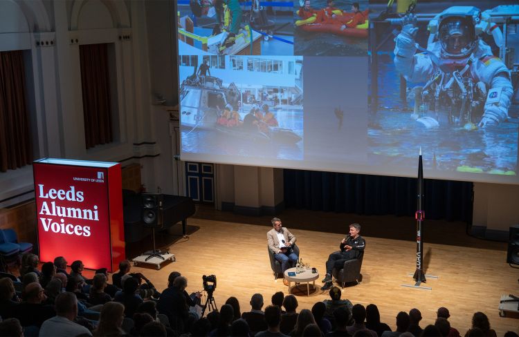 Matthias Maurer speaking with Mark Dorey at the Leeds Alumni Voices event, sitting next to one of LURA's rockets.