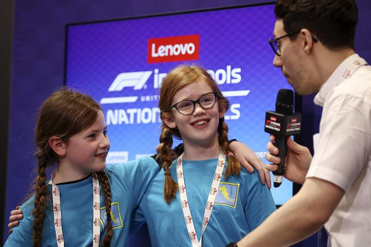 Two children being interviewed at an F1 in Schools event.