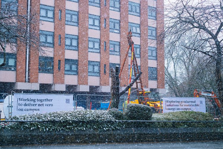 Geothermal drilling during snowy conditions outside of the Henry Price Residence building, 2025 (Credit: Ben Craven, School of Earth and Environment)