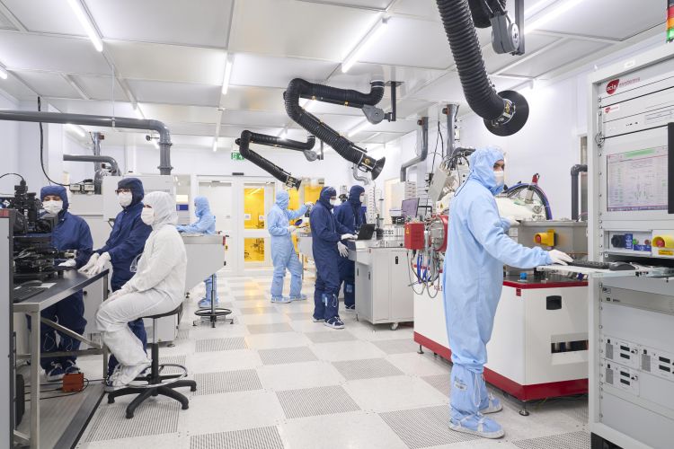 The Bragg Centre for Materials Research's cleanroom with researchers working inside.