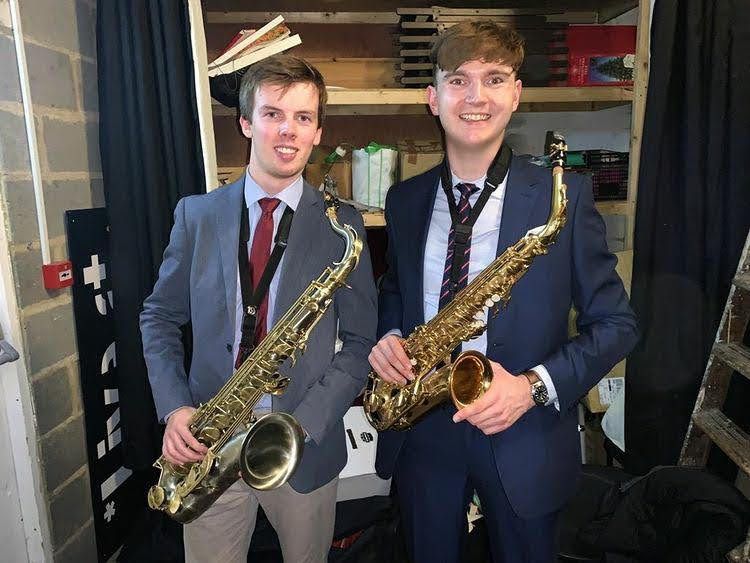 Two male students in music society