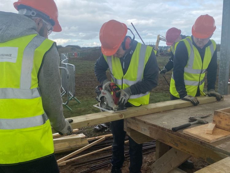 Image of Oliver Robinson working at a construction site.