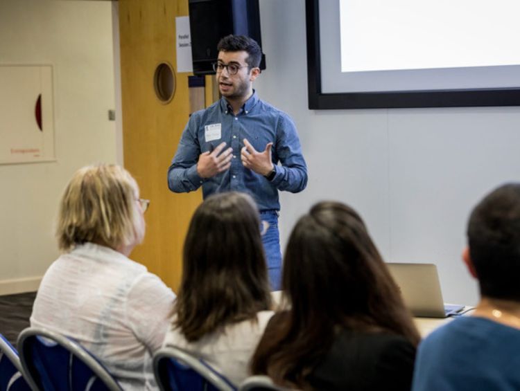 Recent picture of Rafael Papallas in 2023, invited to talk about our research at the UK-RAS International Robotics Showcase event in Bristol.