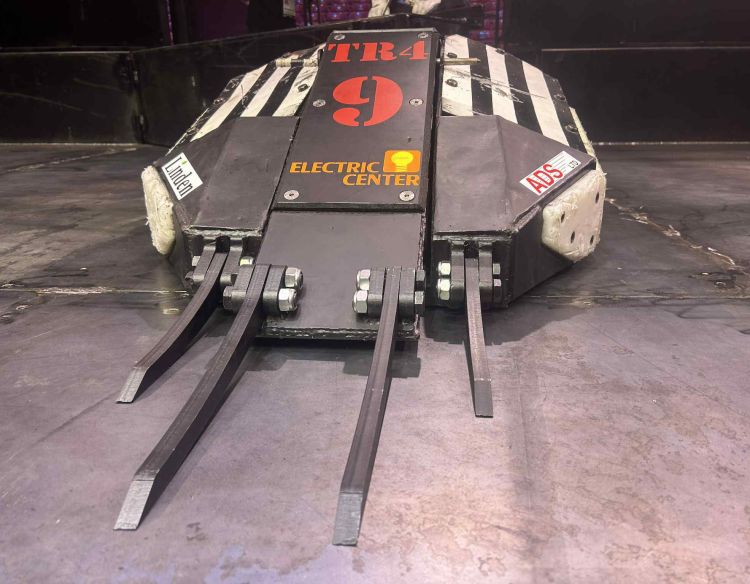 TR4 robot on a floor.