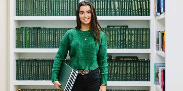 Mathematics student holding books