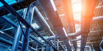 Multiple ventilation ducts running horizontally inside on a building.