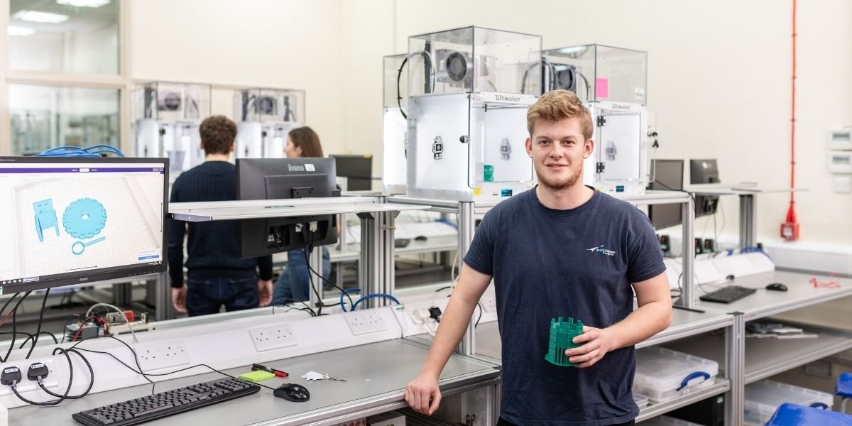 A student stood inside a mechanical engineering lab at the University of Leeds.