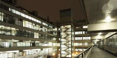 Exterior night shot of Worsley Building, home to the Faculty of Biological Sciences