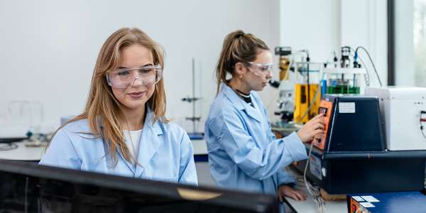 Two female chemical engineering students working in a teaching laboratory
