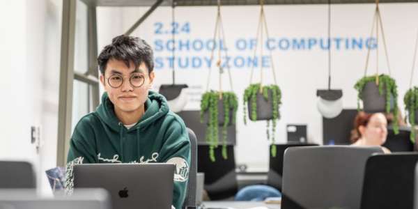 Student in the School of Computing, Bragg building, study zone