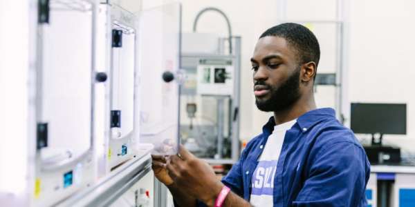 A student in a lab in the School of Electronic and Electrical Engineering.