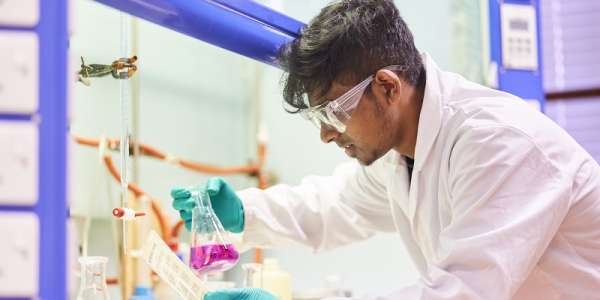 A Leeds chemistry student practicing his lab skills in preparation for a successful career